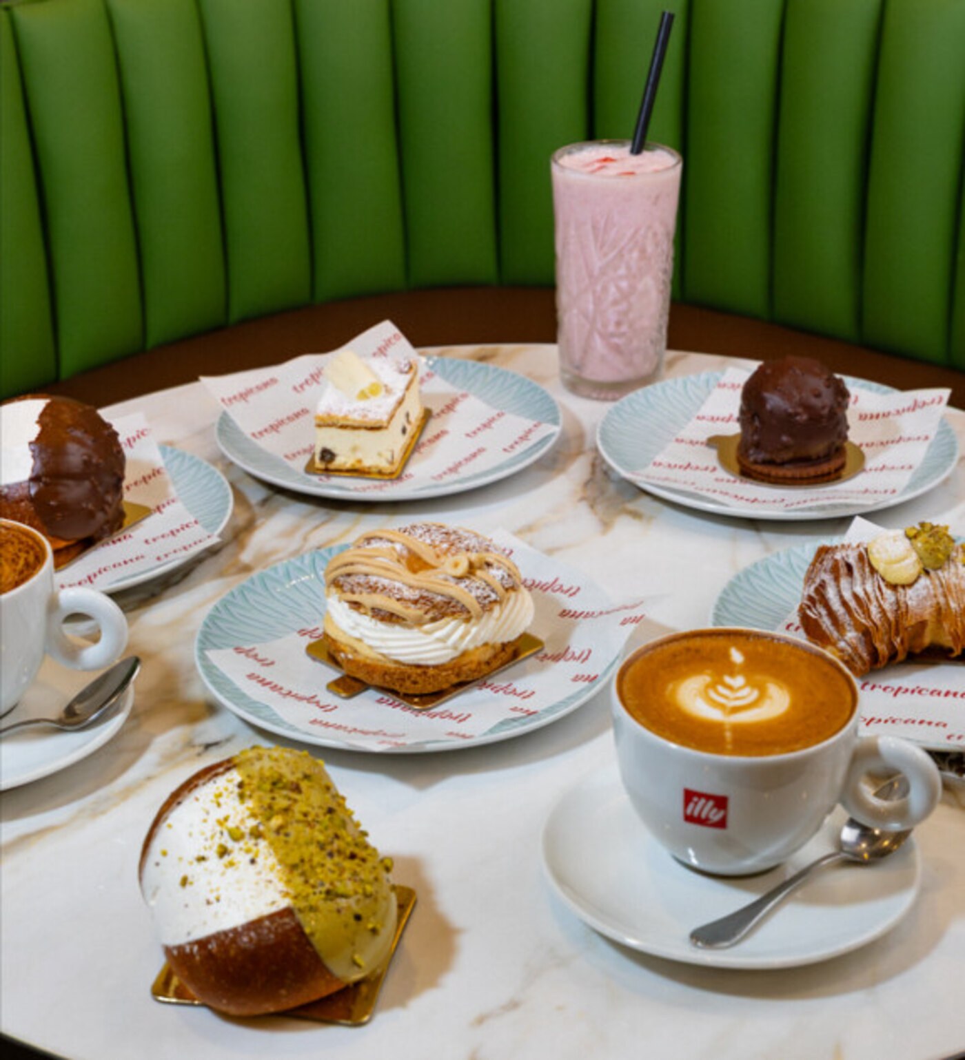 Sweets selection with cappuccino and milkshake